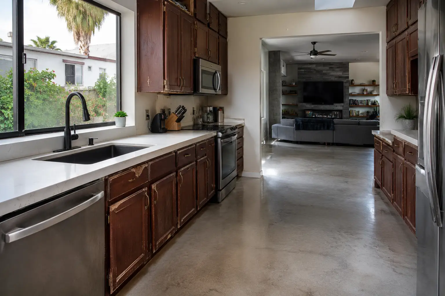 Kitchen Remodeling Chandler AZ before cabinet installation with worn wood cabinets, faded finishes, damaged doors, and outdated kitchen storage