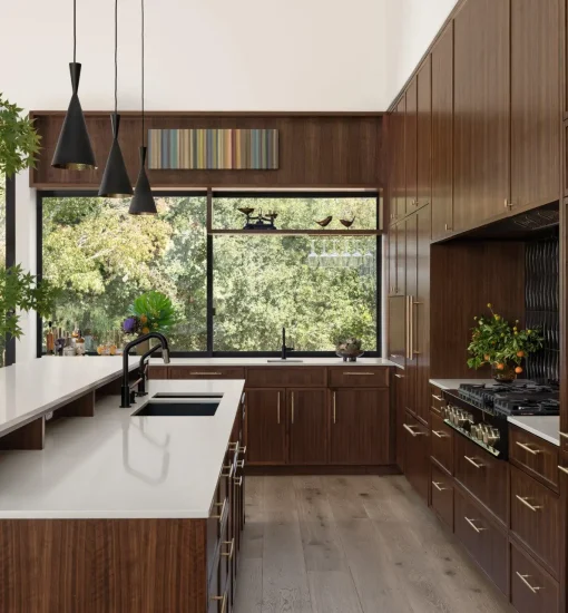 Luxury Scottsdale kitchen featuring custom walnut cabinets, white quartz countertops, and professionally installed built-in appliances.